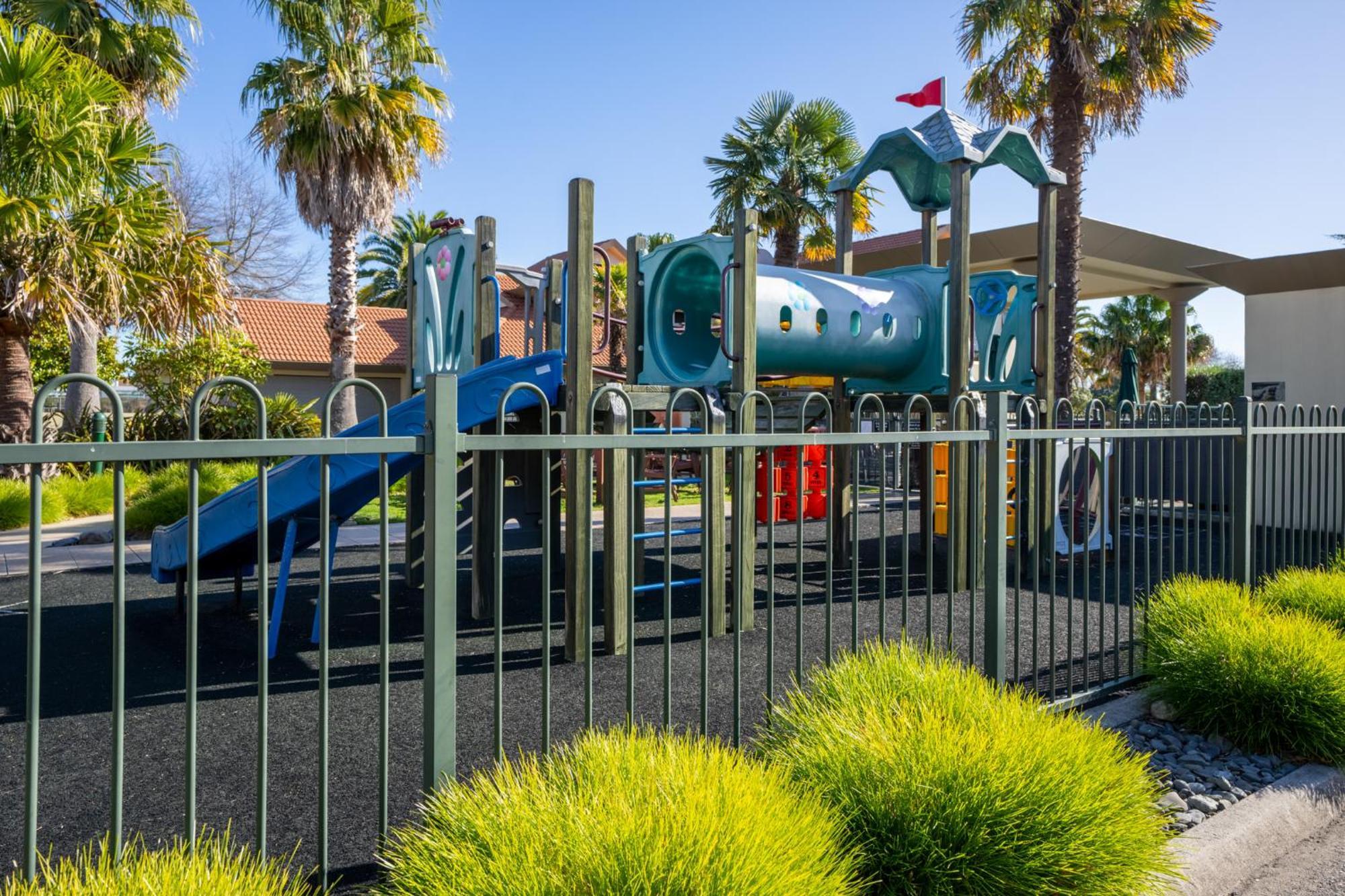 Regal Palms Resort Роторуа Экстерьер фото Playground at the park